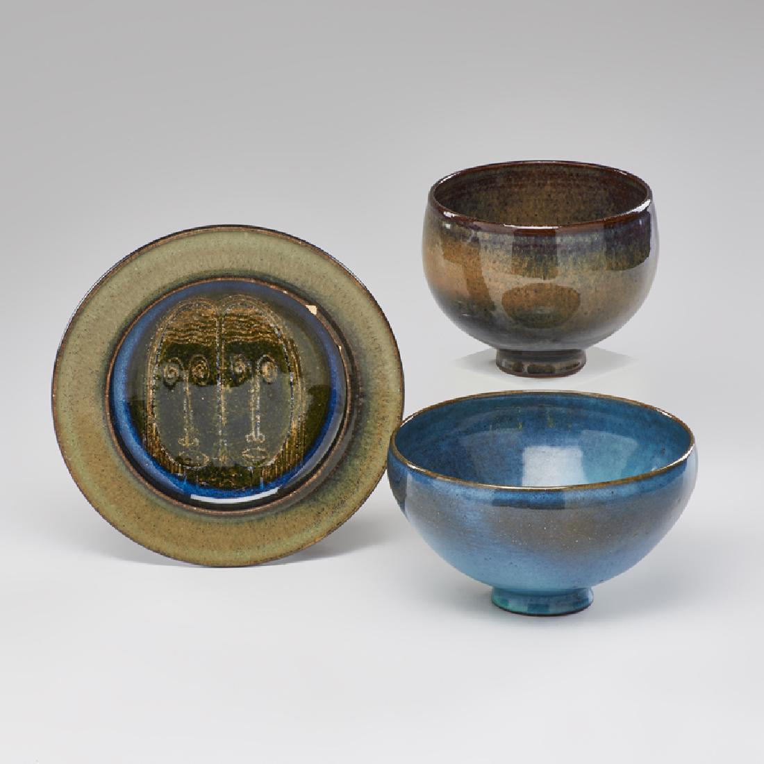 EDWIN SCHEIER (1910-2008); MARY SCHEIER (1908-2007: Three pieces: two footed bowls in Hare's Fur glazes and plate decorated with faces, New Hampshire, mid-20th c. Glazed earthenware Incised Scheier Larger bowl: 3 1/2" x 6" dia., plate: 1" x 7" dia.