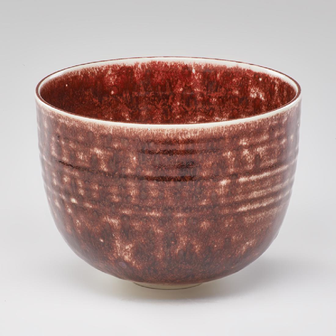 BROTHER THOMAS BEZANSON (1929-2007): Large ribbed bowl, mottled Copper Red glaze, Weston, VT Porcelain Signed "Benedictine Monks, Weston Vermont", ichthys symbol 6 1/2" x 8 3/4"