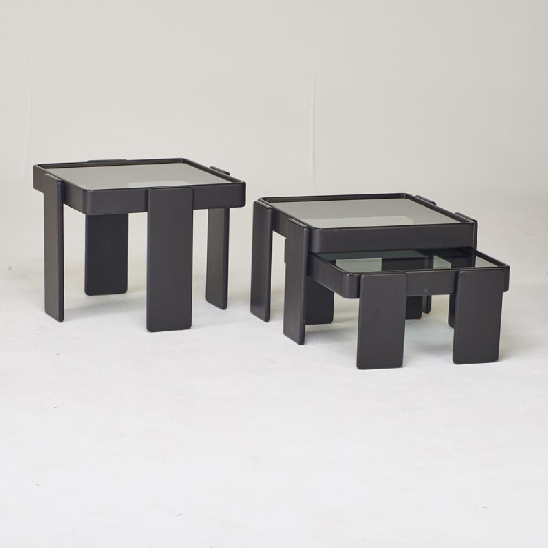 MODERN: Trio of nesting tables, ca. 1970s Enameled wood, smoked glass Largest: 18" x 23" sq. Provenance: The Estate of Ruth and Hans Fiuczynski