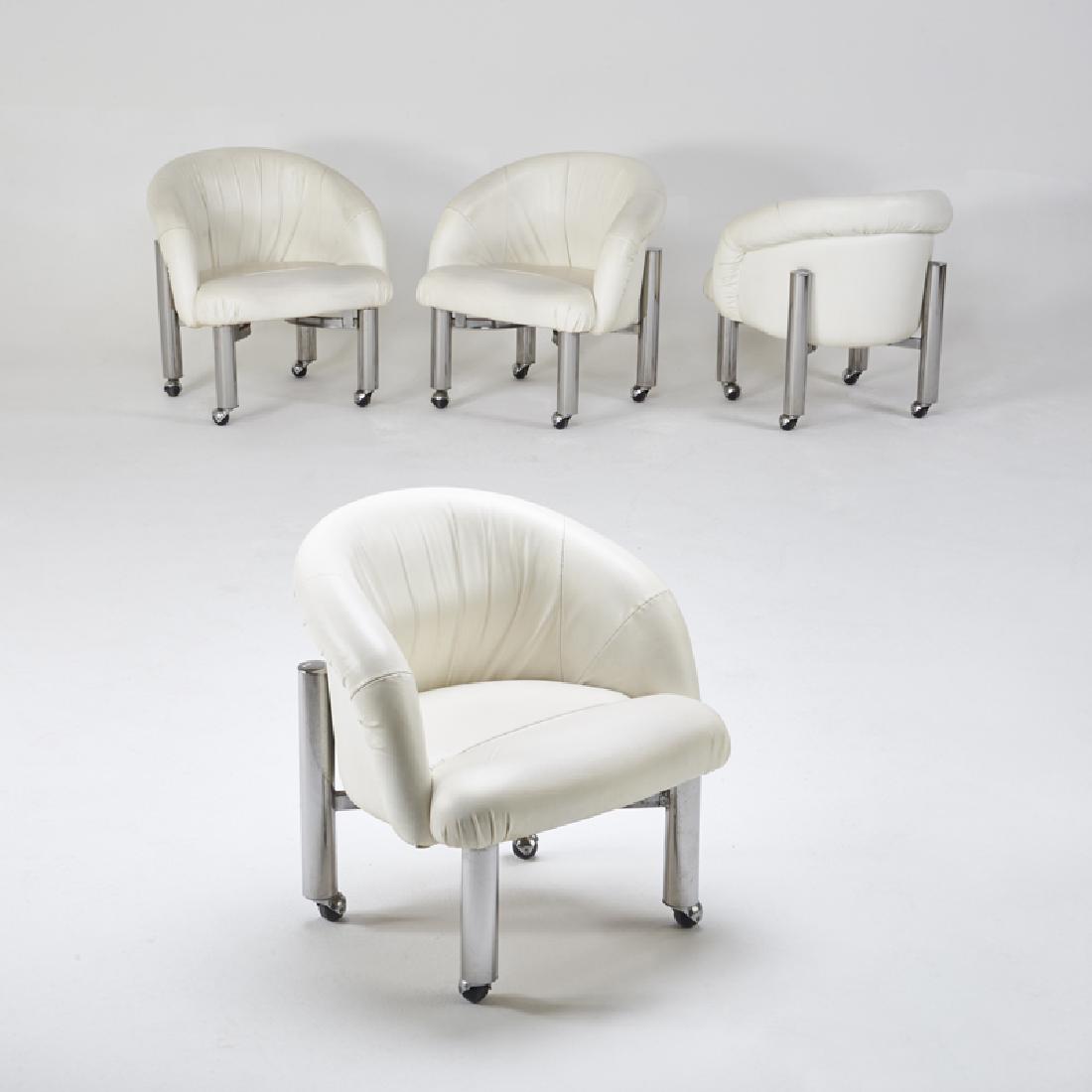 STYLE OF MILO BAUGHMAN: Four low, wide armchairs on casters, 20th c. Chromed steel, vinyl Unmarked 29" x 29" x 27"