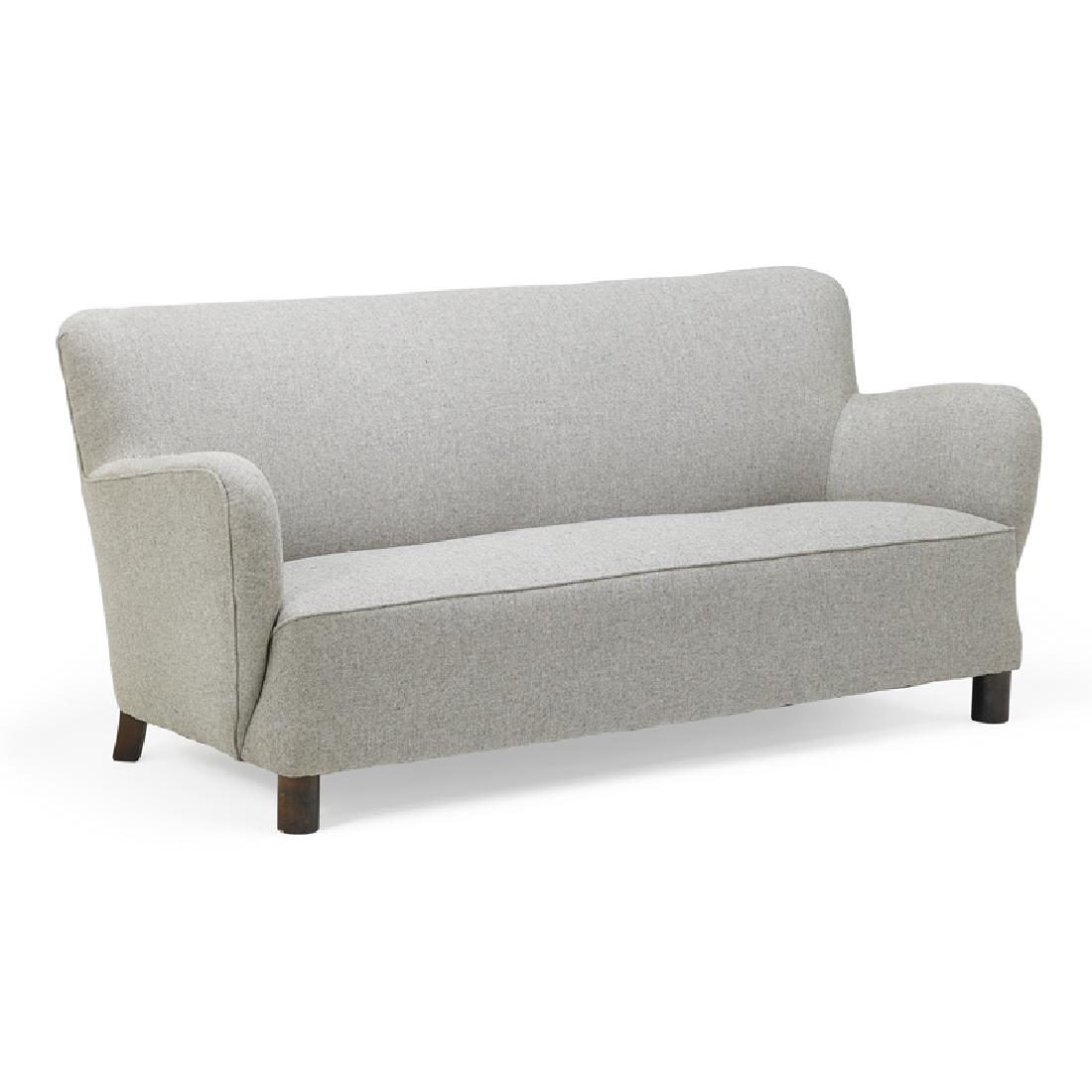 STYLE OF FLEMMING LASSEN Sofa: STYLE OF FLEMMING LASSEN Sofa, Denmark, 1950s Stained wood, upholstery Unmarked 31" x 69" x 36"