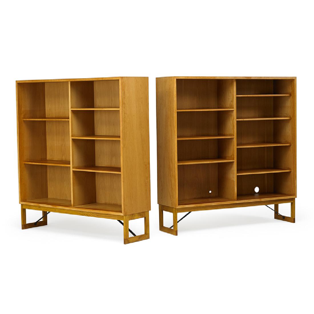 BORGE MOGENSEN Pair of bookcases: BORGE MOGENSEN (1914 - 1972) KARL ANDERSSON & SONER Pair of bookcases, Sweden, 1950s Oak, enameled metal Manufacturer label to one 56" x 53" x 14 1/4"