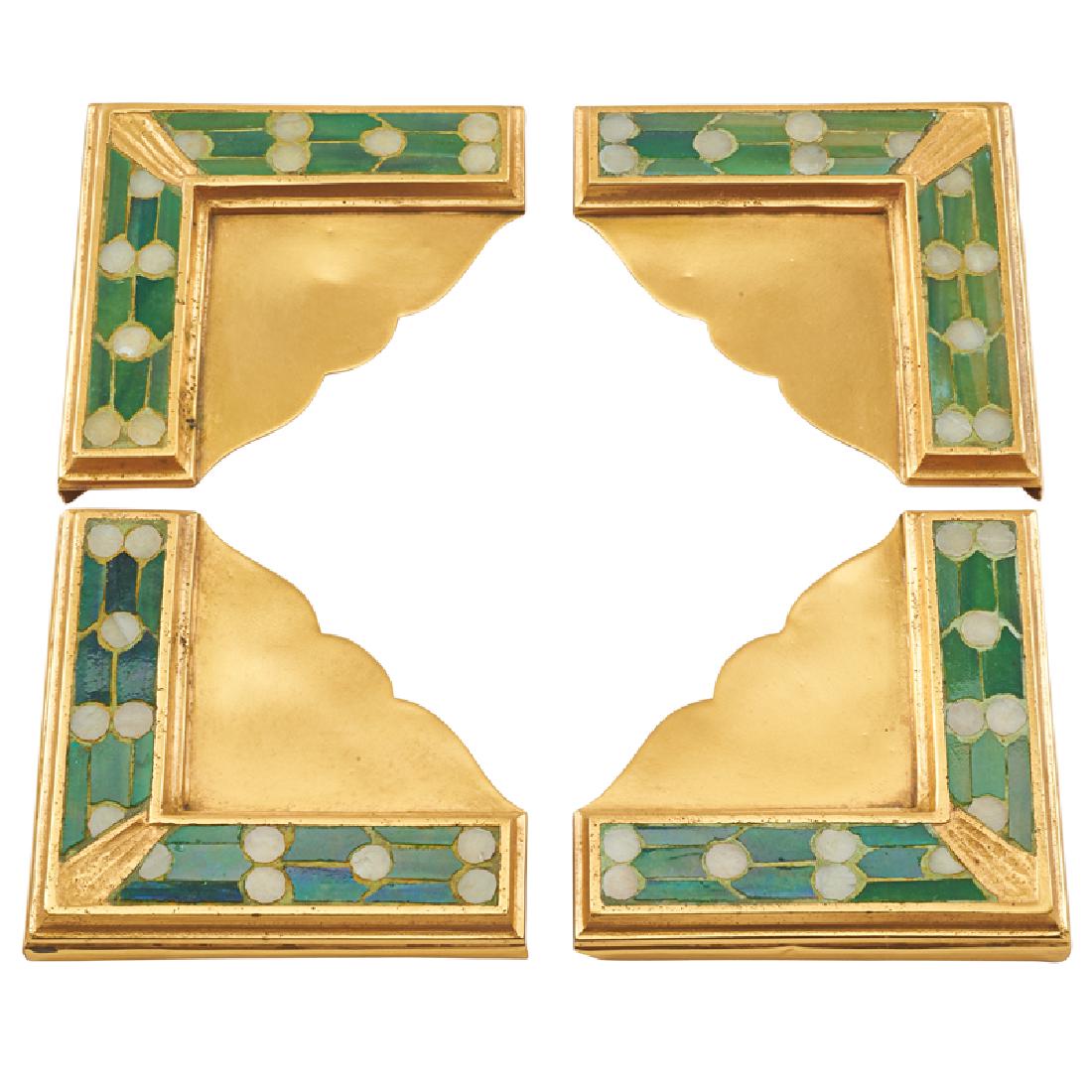 TIFFANY STUDIOS STYLE BLOTTER CORNERS: Four: Each brass corner inlaid with glass tiles in a foliate motif, 20th c. 3 1/2" x 3 1/2"