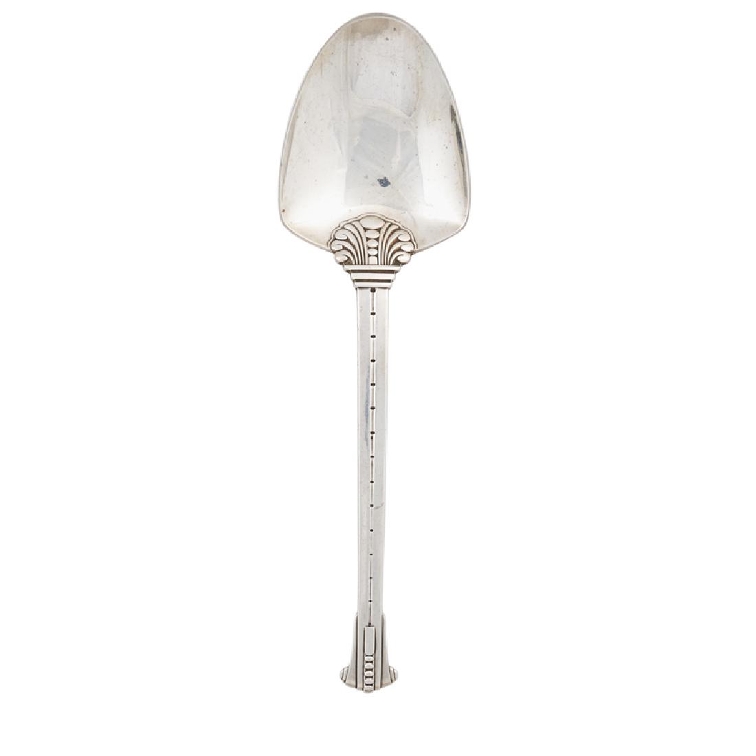 TIFFANY & CO. STERLING SILVER SERVING SPOON: Art Deco design, USA, 1937; Marked "TIFFANY & CO/ STERLING/m"; 10 1/4", 5.2 ozt; Note: This pattern is illustrated in Stern, Jewel. "Modernism in American Silver: 20th Century Design" New Haven, CT: Y