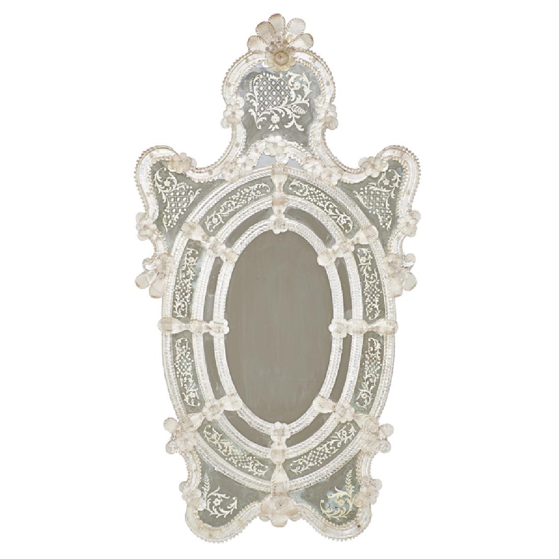 VENETIAN STYLE MIRROR: Decorated with rosettes, Continental, 20th c.; 49" x 26"