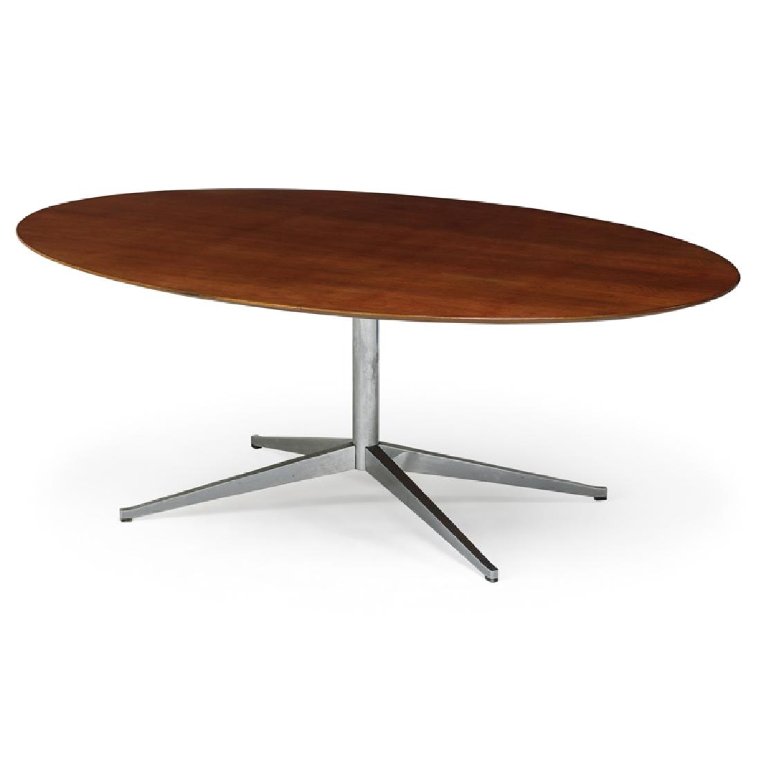 FLORENCE KNOLL FOR KNOLL ASSOCIATES TABLE: Chromed steel and rosewood oval dining table, New York, 1960s; 28" x 78" x 48 1/4"