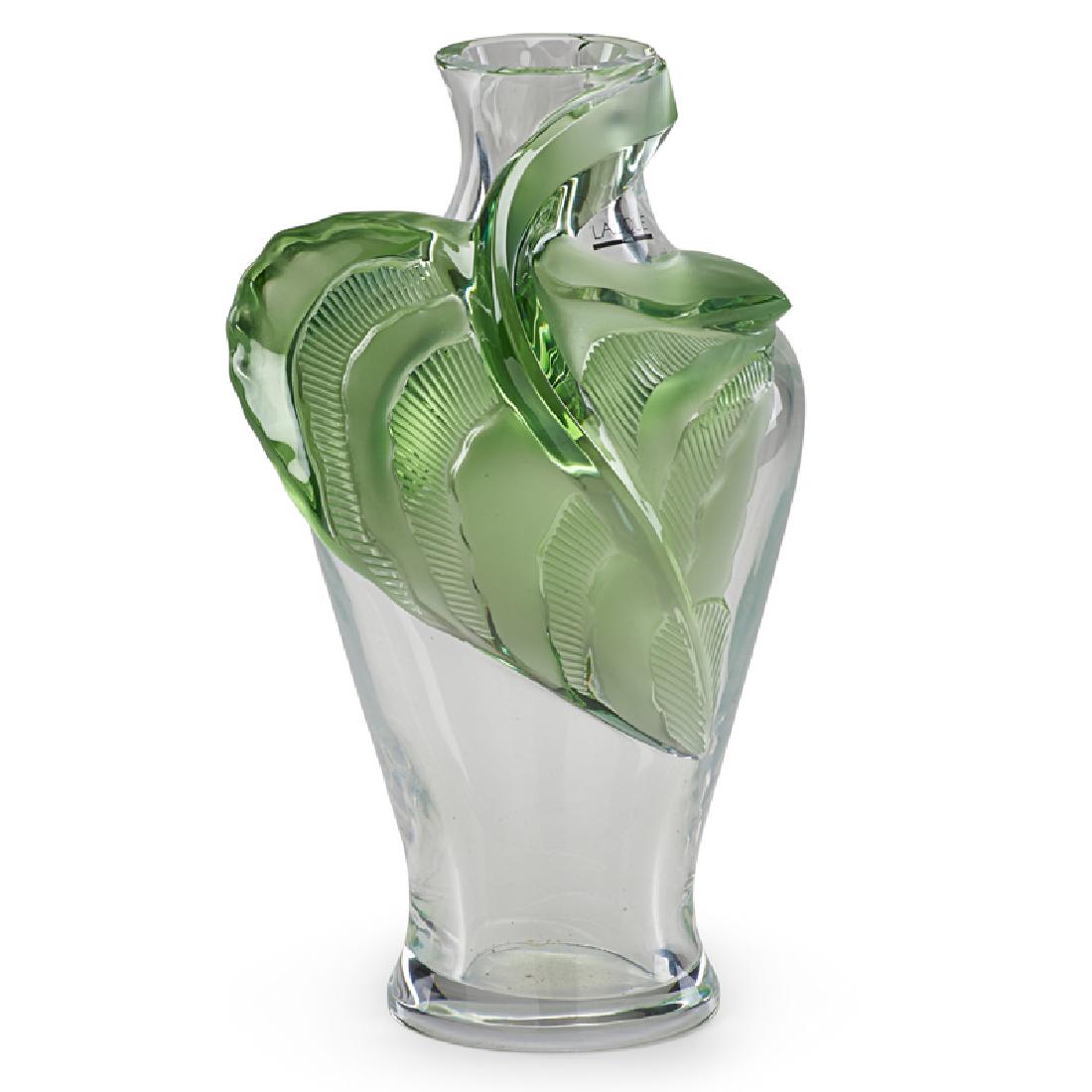LALIQUE "TANEGA" GLASS VASE: Wrapped in three dimensional leaf, accompanied by original fitted box; Signed and dated "M. Lalique 3.15.90"; 14 1/2" x 8" x 8"; Provenance: The Gary & Helen Kalpakjian Collection