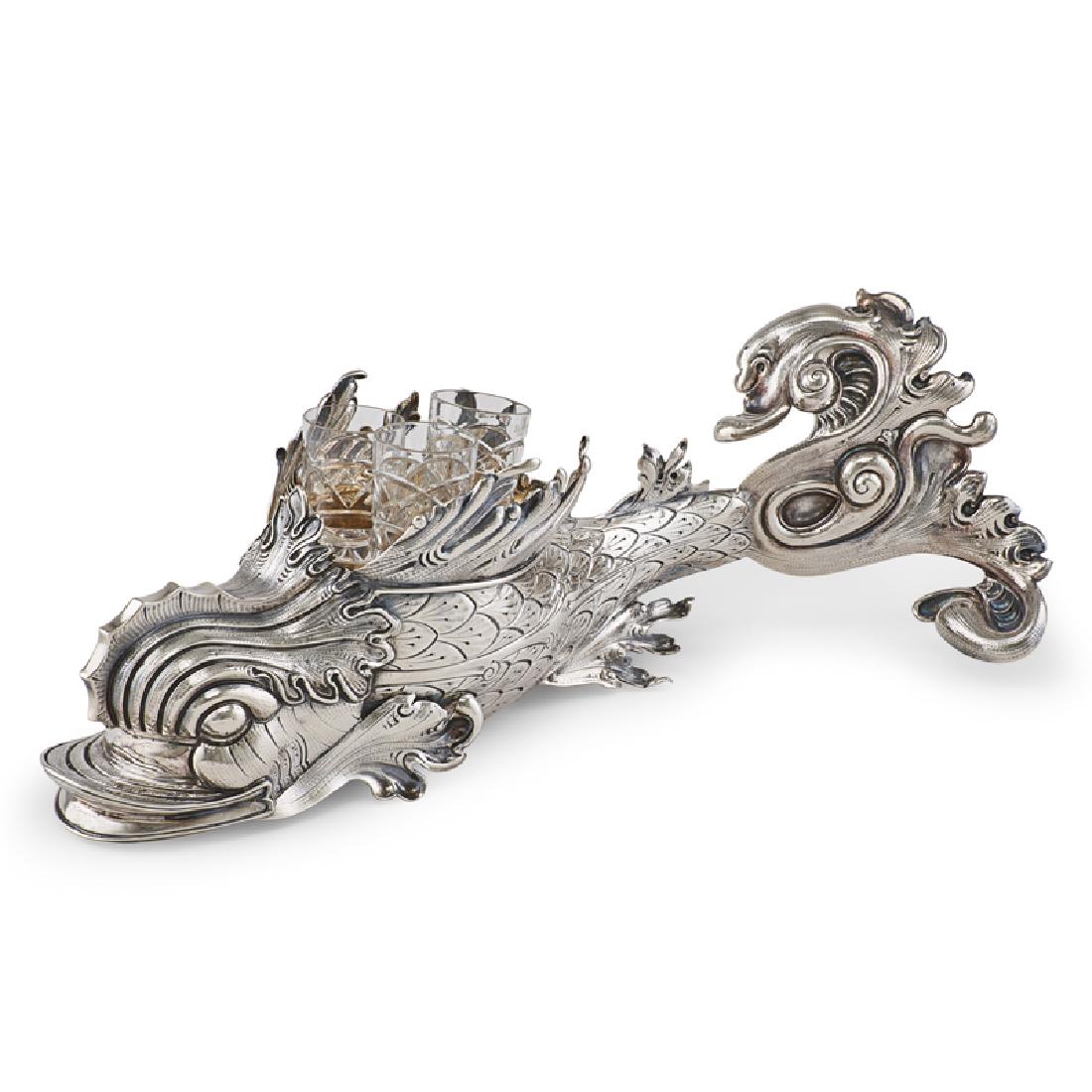 ITALIAN STERLING SILVER DOLPHIN-FORM VODKA SERVER: Removable insert holds three cut crystal vodka cups (one marked "Faberge"), Italy, 21st c.; Marked "1985/MI"; 5 1/2" x 17", 52 ozt (weighable)