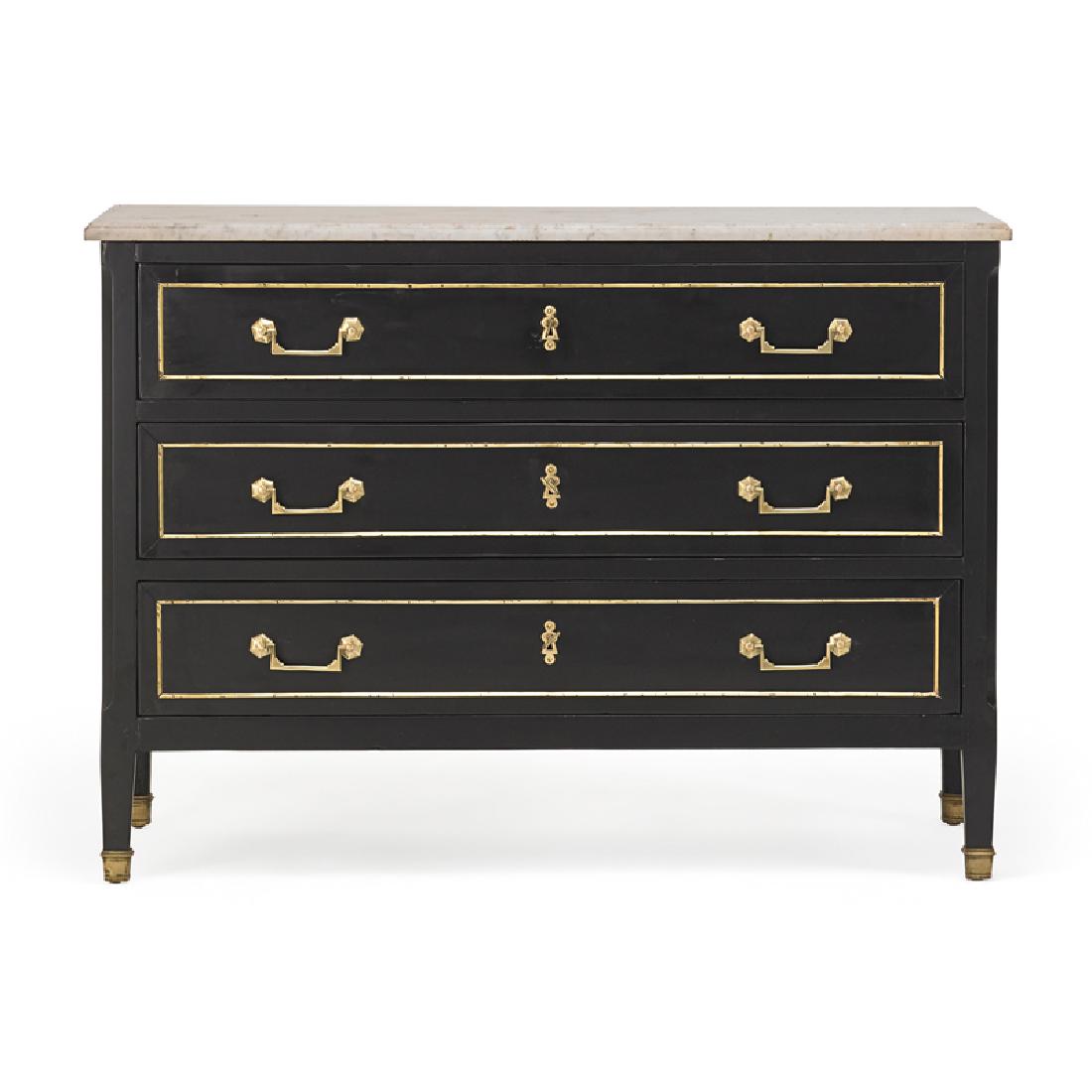 LOUIS XVI STYLE EBONIZED COMMODE: In the manner of Jansen, brass bound with a white marble top, France, 19th c.; 32 1/2" x 45 1/2" x 21 1/2"