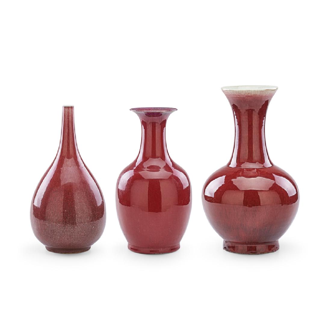 THREE CHINESE SANG DE BEOUF PORCELAIN VASES: Each a different form, China, 19th/20th c.; One with wax seal; Largest: 18" x 10" dia.