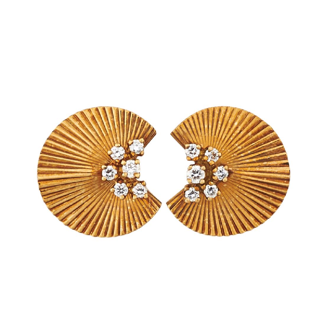 McTEIGUE DIAMOND & YELLOW GOLD RUFFLE EARRINGS: Each a curled gold ribbon with RBC diamond cluster, approx. .37 ct. TW. throughout. Ca. 1940. 18k. Stamped by the maker. 3/4". 4.1 dwt.