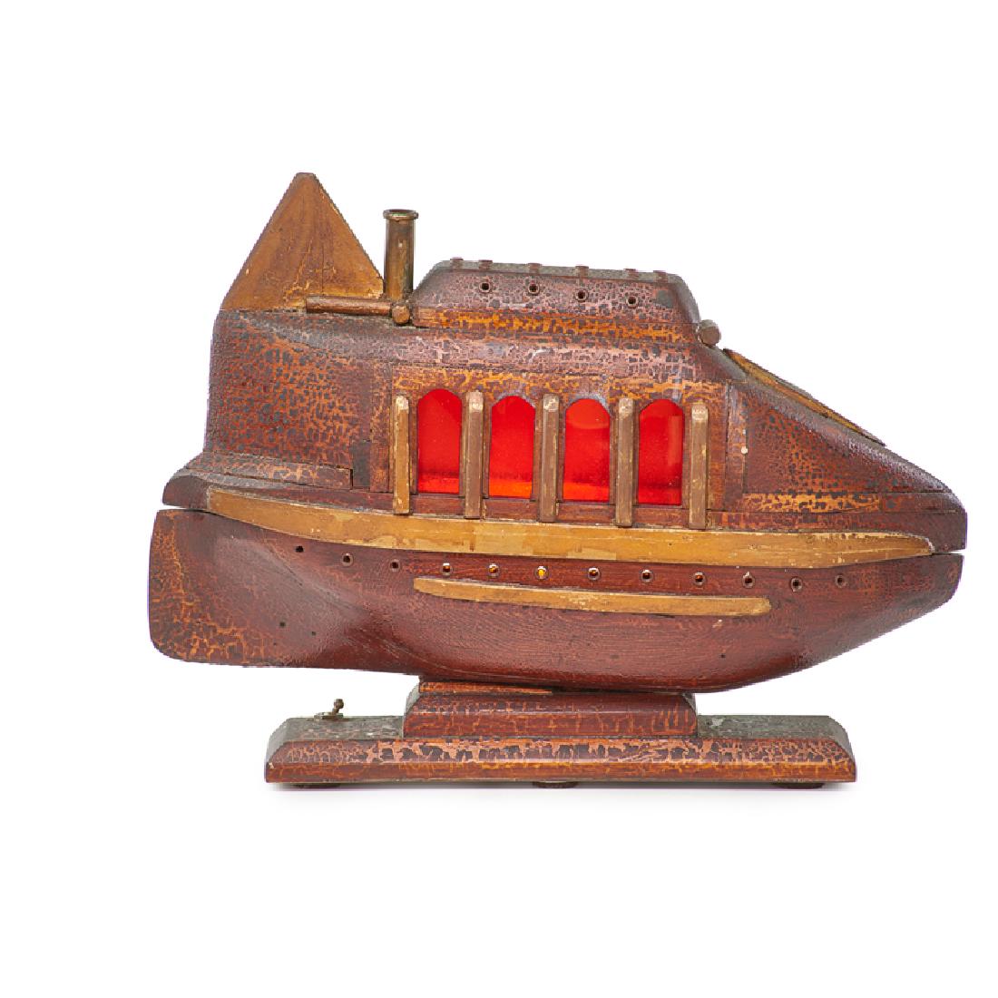 ONE-OF-A-KIND CARVED SUBMARINE LAMP: Hand-carved wooden lamp in the shape of the Beatles' Yellow Submarine, USA, 20th c., 19" x 6" x 12"