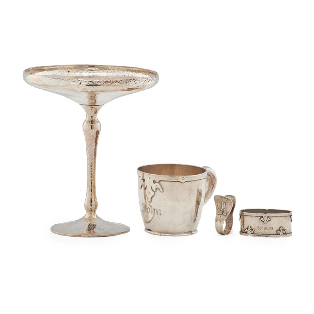 SHREVE ETC. Sterling silver: SHREVE ETC. Four pieces, early 20th C.: compote, baby cup, and napkin ring in the 14th Century pattern, along with a John Bellis napkin clip monogrammed "A" Sterling silver All marked Compote: 6 3/4"