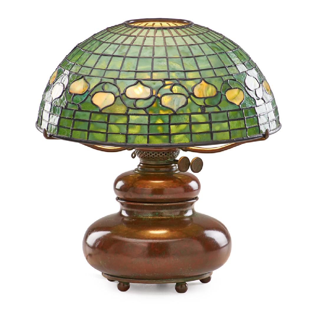TIFFANY STUDIOS Vine pattern table lamp: TIFFANY STUDIOS Squat table lamp with Vine pattern shade, New York, ca. 1900 Patinated bronze, leaded slag glass, single socket Font stamped TIFFANY STUDIOS NEW YORK TGDCO. D 890, metal TIFFANY STUDIO