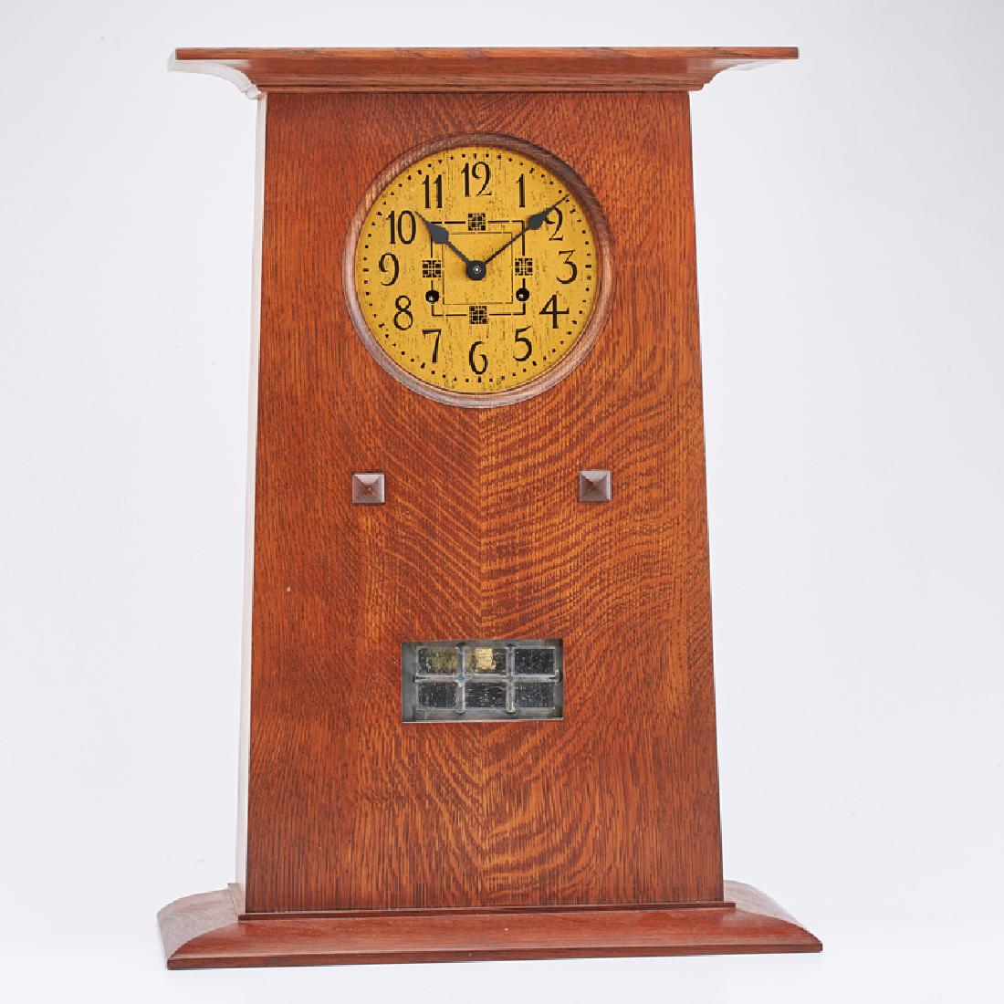 STICKLEY; E.J. AUDI: Contemporary trapezoidal mantle clock in the style of Peter Hansen/L. & J. G. Stickley, model no. 89-85, Manlius, NY, 2016 Quartersawn oak, leaded glass, brass Metal tag, branded mark 22" x 16" x 7"