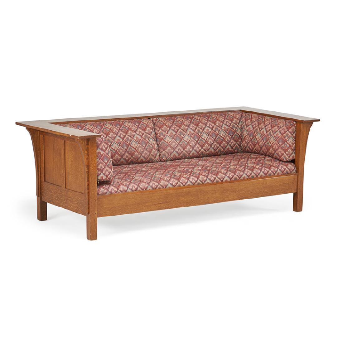 STICKLEY; E.J. AUDI: Contemporary three-seat paneled prairie settle, in the style of L. & J.G. Stickley, Manlius, NY, 1990s Quartersawn oak, fabric uphostery Upholstery tag 29" x 84" x 37 1/2"