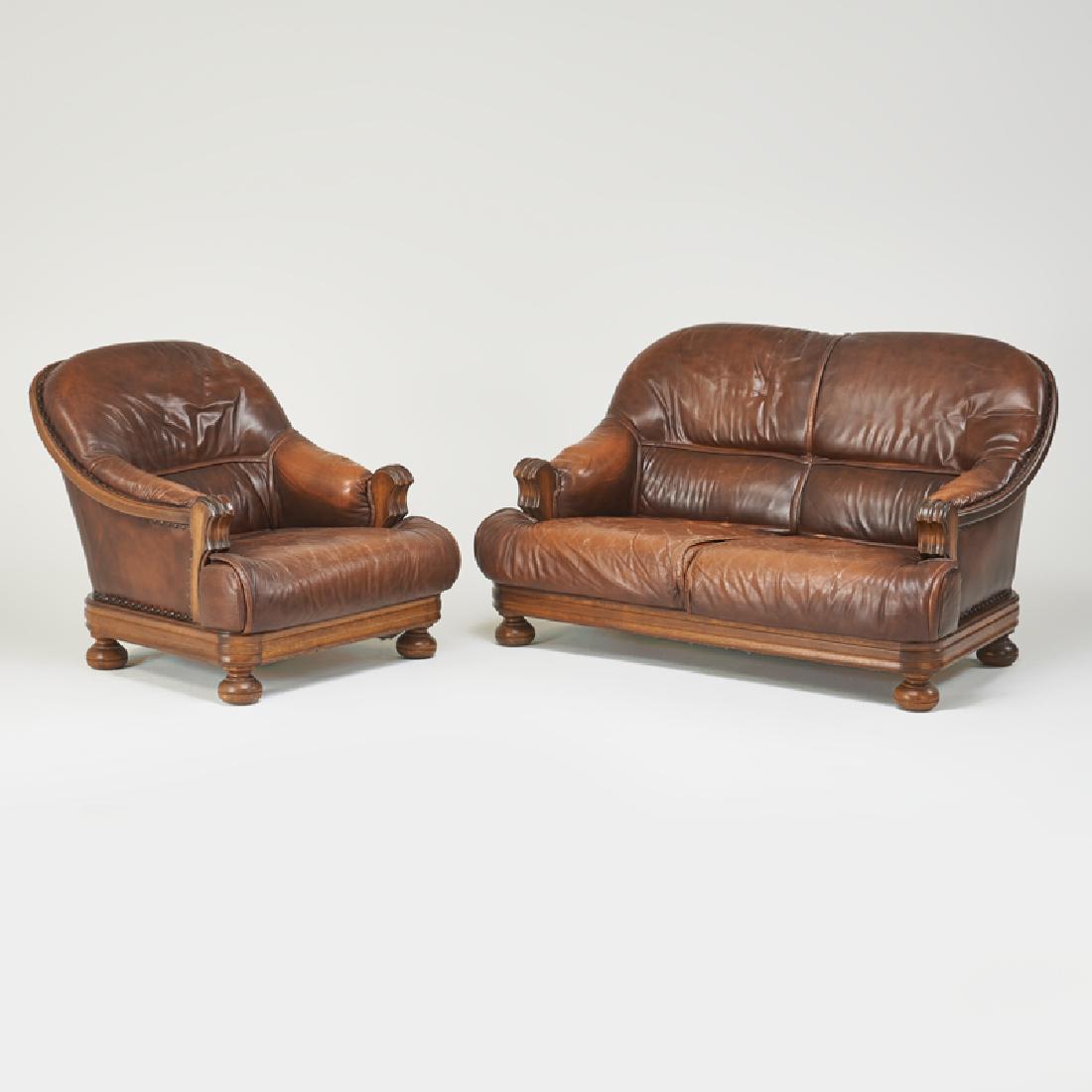 EDWARDIAN STYLE: Lounge chair and two-seat sofa, USA, second half 20th c. Oak, leather, brass tacks Unmarked Chair: 35" x 35" x 40", sofa: 35" x 60" x 38"