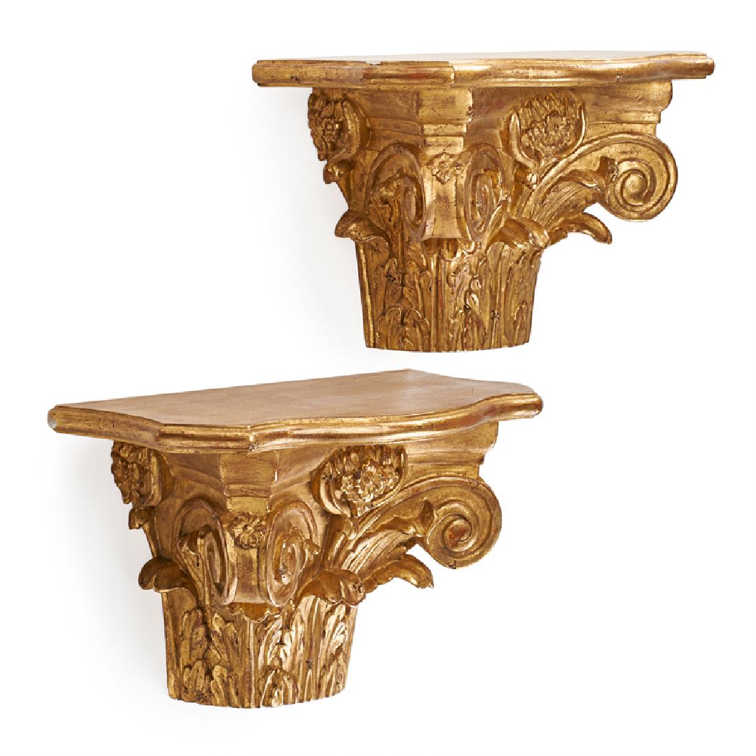 NEOCLASSICAL STYLE: Pair of wall brackets, each modeled as a Corinthian capital, Continental, 20th c. Giltwood 9 1/4" x 15 1/4" x 8 1/4"