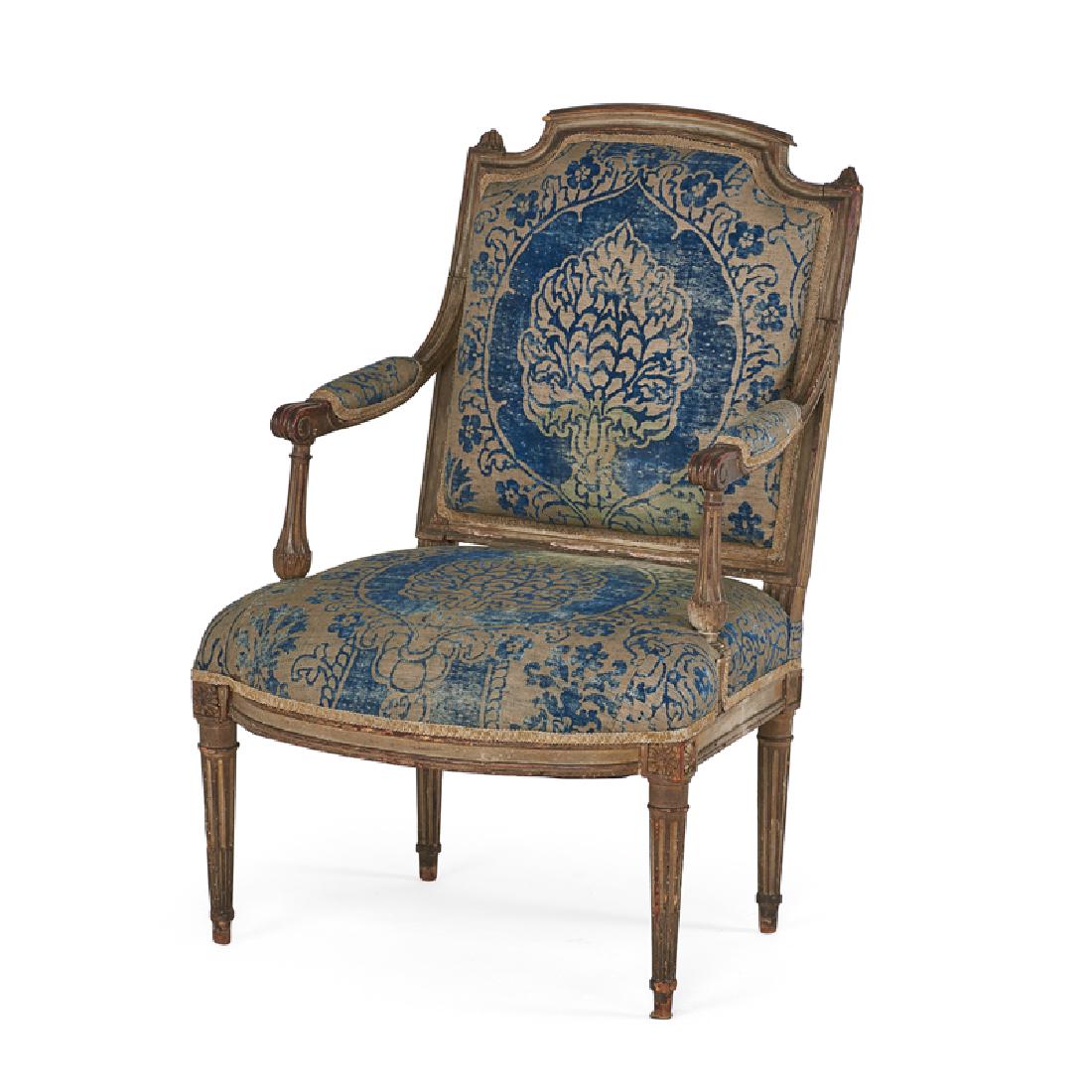 LOUIS XVI STYLE: Carved bergere Painted and distressed wood, with Fortuny upholstery, 20th c. 25 1/2" x 27"