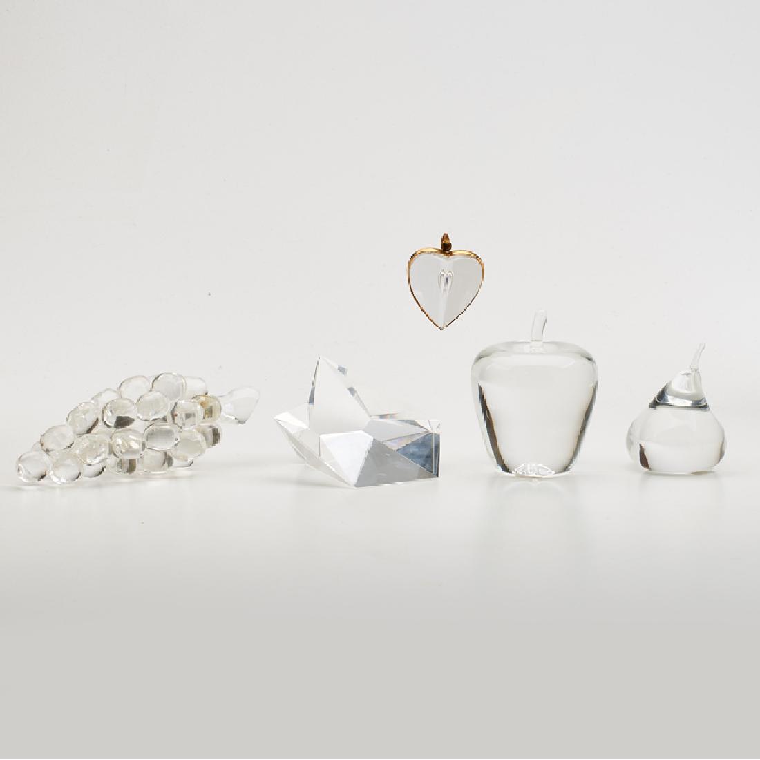 STEUBEN: Five glass sculptures: apple, pear, grapes, geometric form, and heart pendant, Corning, NY, 20th c. All but pendant signed, pendant mount marked 18k Grapes: 2 1/2" x 8" x 3"