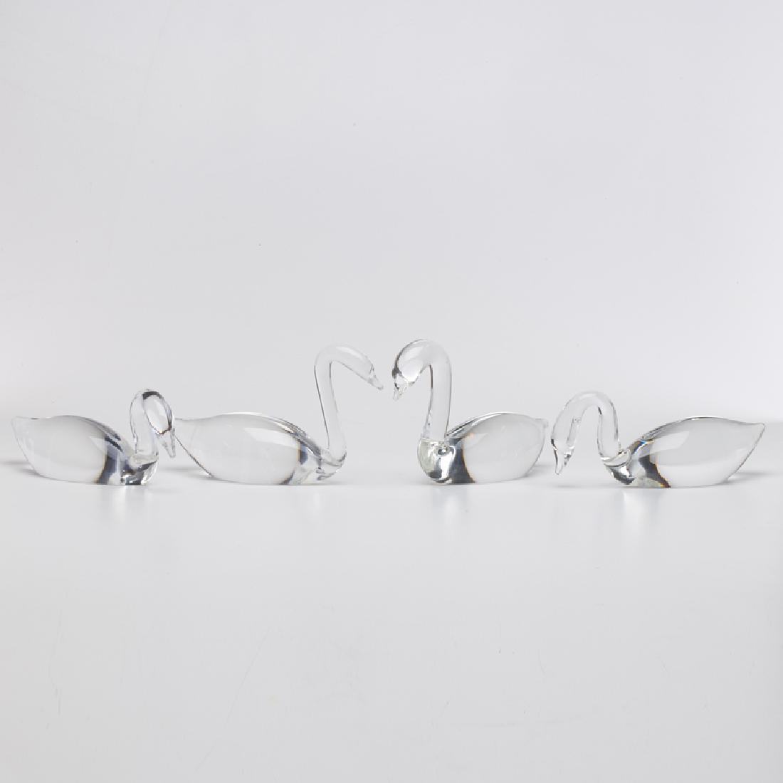 STEUBEN: Four crystal swan figurines, Corning, NY, 20th c. All marked Tallest: 4 1/2" x 6 1/2" x 2 1/2"