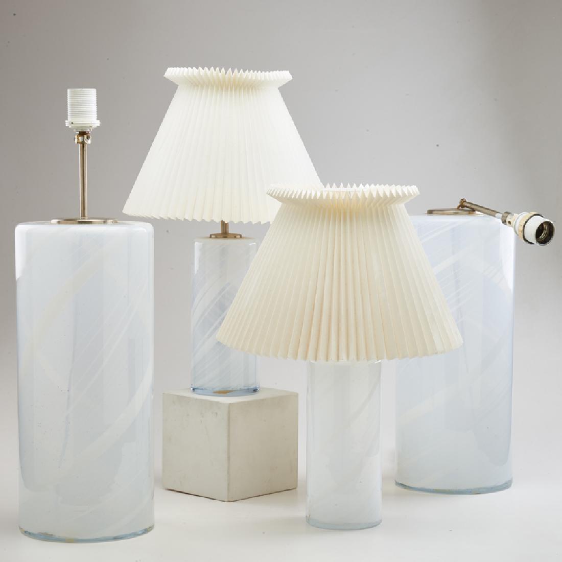 TORBEN JØRGENSEN; HOLMEGAARD: Two pair of cylindrical table lamps with spiral design, Denmark, ca. 1970s Opaline glass, metal fittings One labeled Larger pair: 24" x 7 1/2" dia.