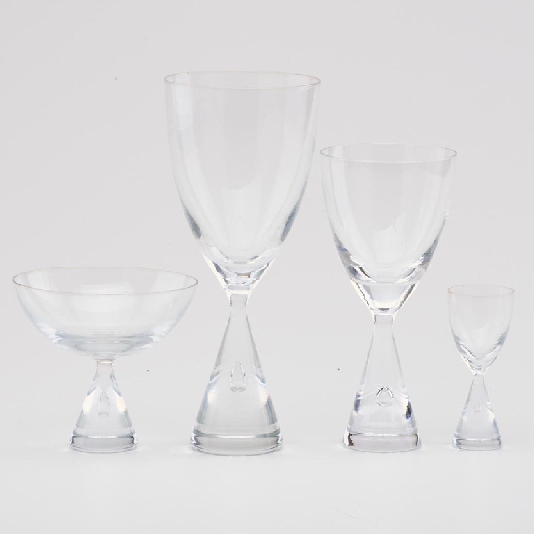 HOLMEGAARD: 46-piece "Princess" glassware set: 12 water goblets, 12 wine glasses, 14 champagne flutes, and 8 cordials, Denmark, 1960s Unmarked Tallest: 8" x 3 1/2" dia.