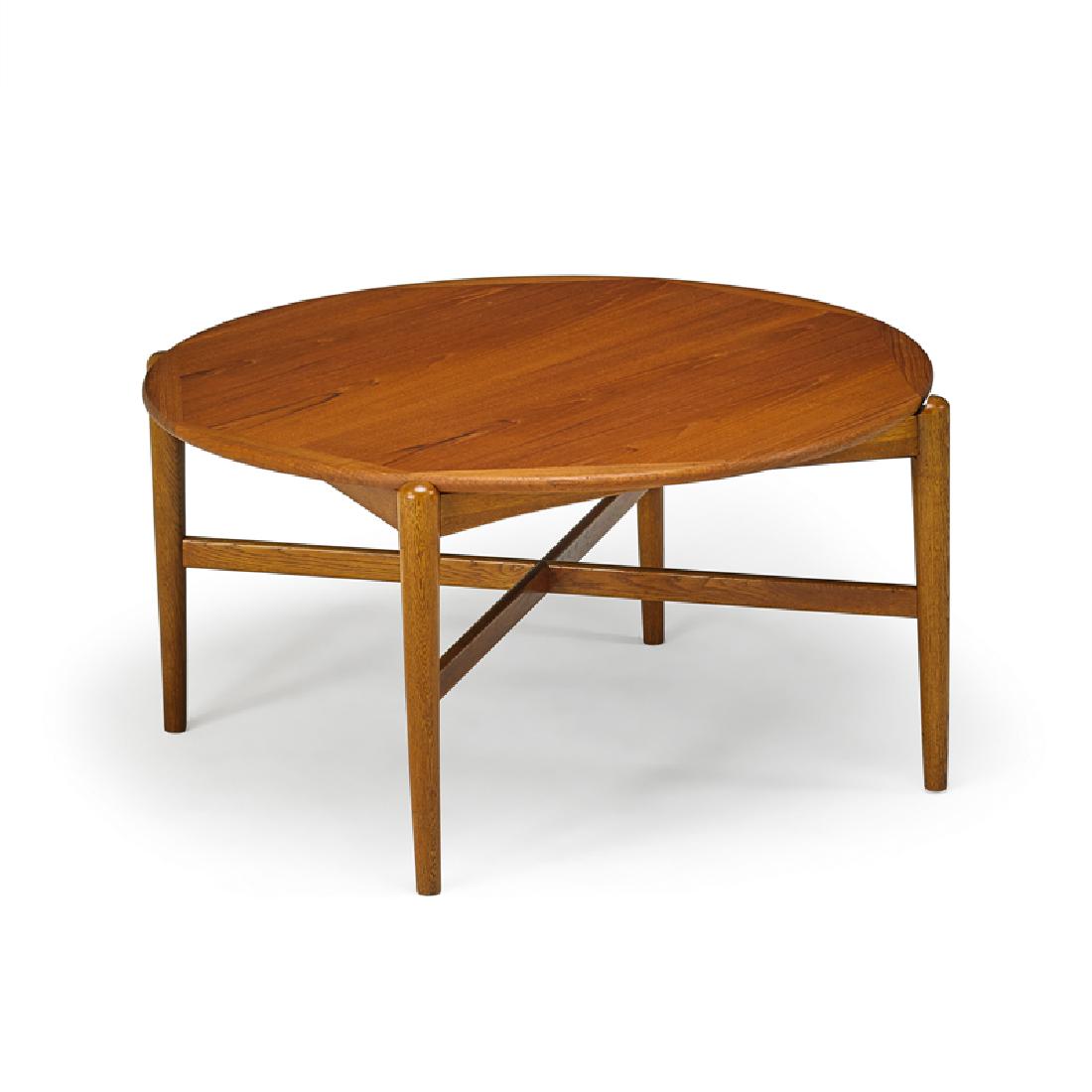 GRETE JALK: Reversible coffee table, Denmark, 1960s Oak, teak, laminate Unmarked 21 1/2" x 41 1/2" dia.