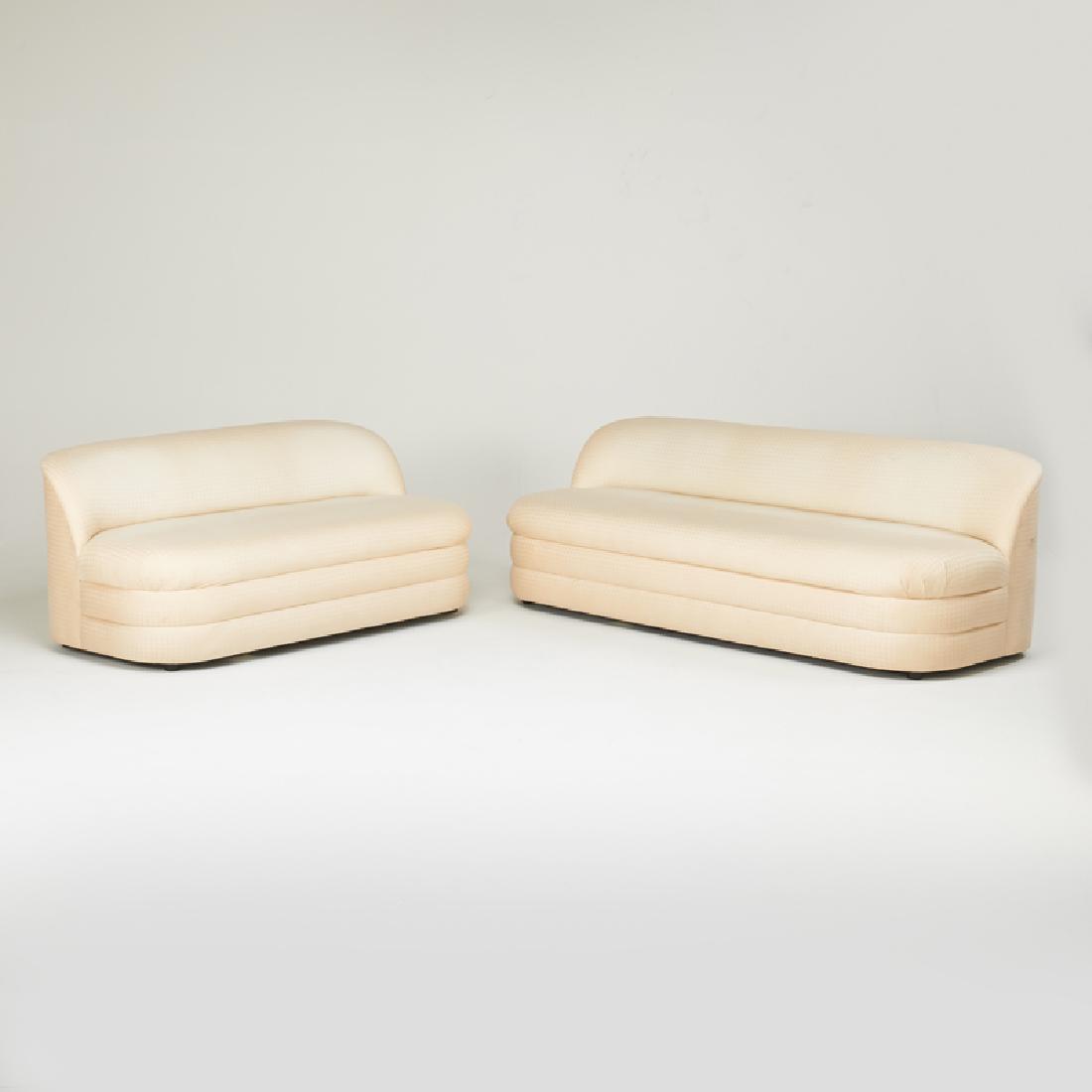 STYLE OF VLADIMIR KAGAN; DIRECTIONAL: Sofa and loveseat, New York, ca. 1980s Manufacturer labels Sofa: 28 1/2" x 86" x 37", loveseat: 29" x 65" x 35"