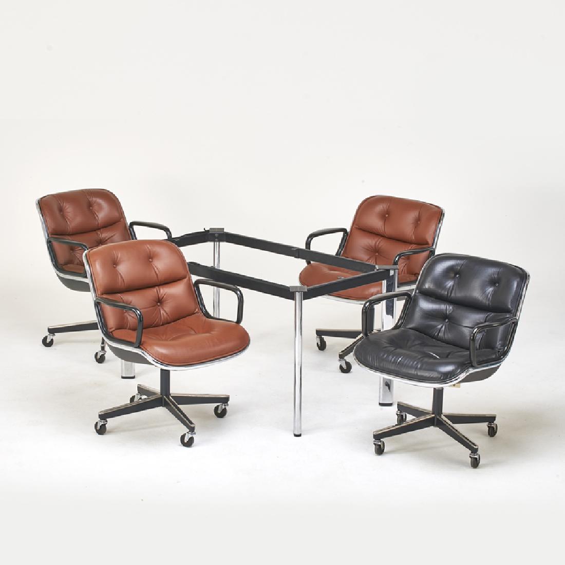 CHARLES POLLOCK/JOE D'URSO; KNOLL INTERNATIONAL: Group of four rolling office chairs and D'Urso conference table base, New York, 1970s Leather, chromed and enameled steel, hardened plastic, fiberglass Upholstery labels to chairs, table marked Chairs