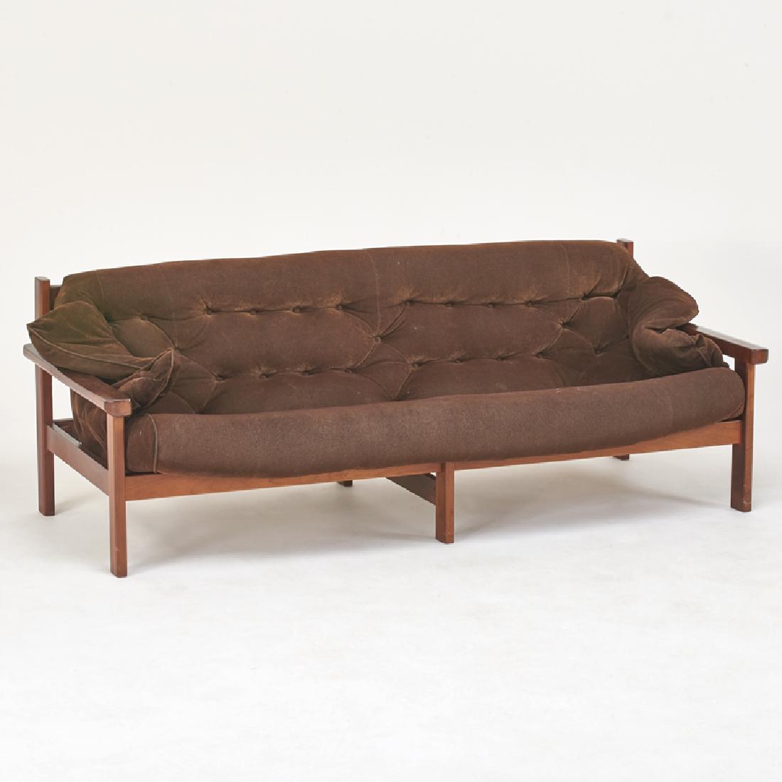STYLE OF JEAN GILLON: Sofa, Brazil, 1960s Stained wood, upholstery 27 1/2" x 76" x 36"