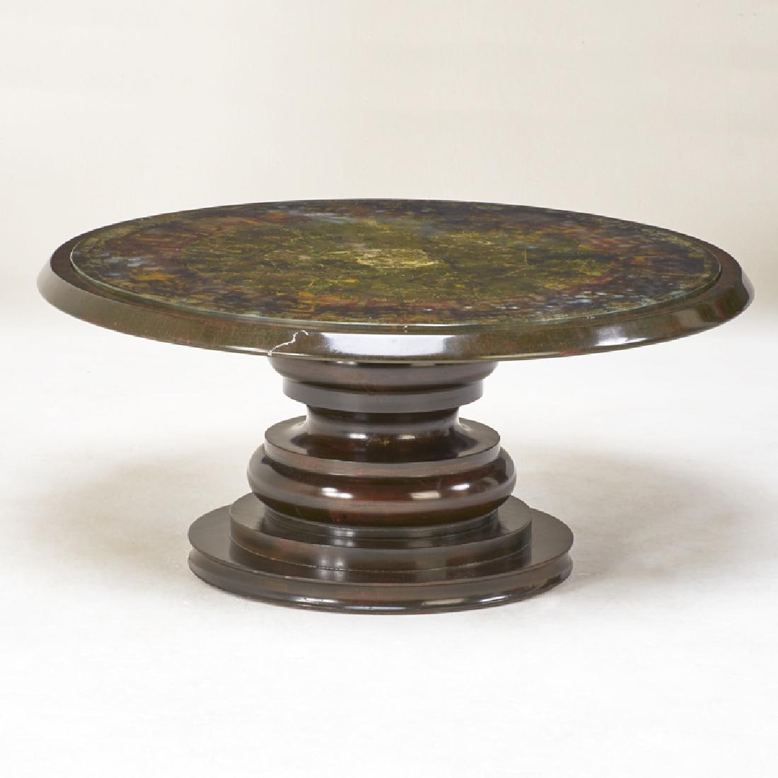 STYLE OF JAMES MONT: Coffee table, ca. 1960s Unmarked Stained and painted wood, reverse painted glass 19" x 43" dia.