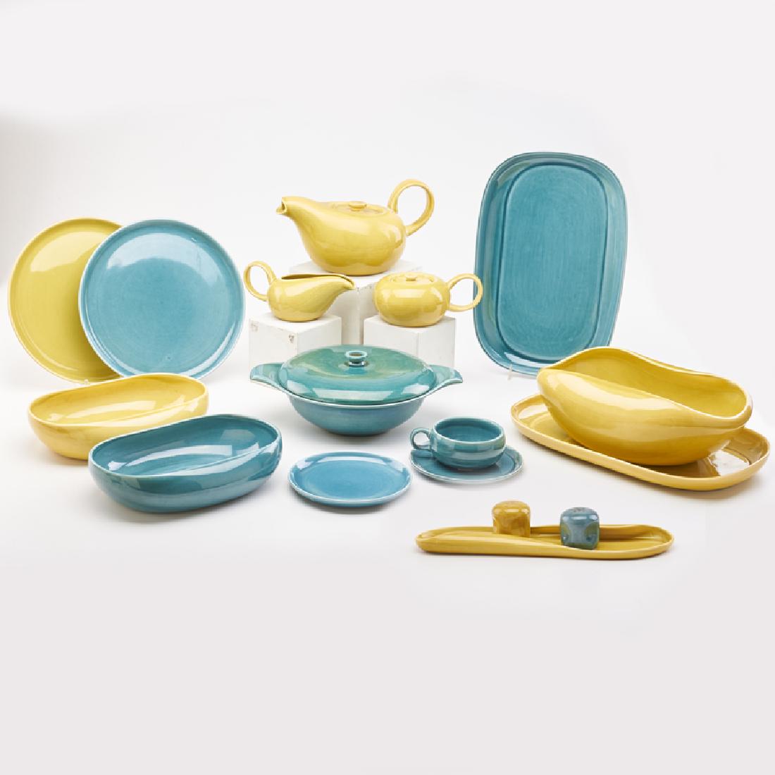 RUSSEL WRIGHT (1904 - 1976); STEUBENVILLE POTTERY: 56-piece "American Modern" service set in chartreuse and teal: 13 dinner plates (9 7/8"), 11 bread plates (11"), teapot, 9 cups (5"), 7 saucers (6"), 2 creamers, 1 sugar, 4 oval serving bowls (10"), 1