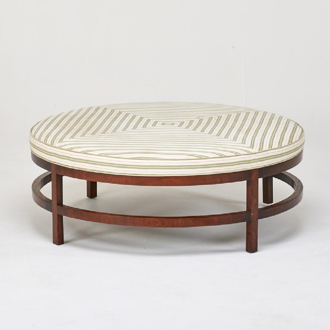 STYLE OF EDWARD WORMLEY: Large round bench, USA, latter half of 20th c. Mahogany, upholstery Unmarked 17 1/2" x 48 1/2" dia.