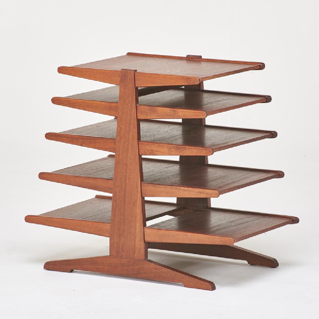 STYLE OF EDWARD WORMLEY: Magazine tree, USA, latter half 20th c. Mahogany 24 1/2" x 28" x 15"