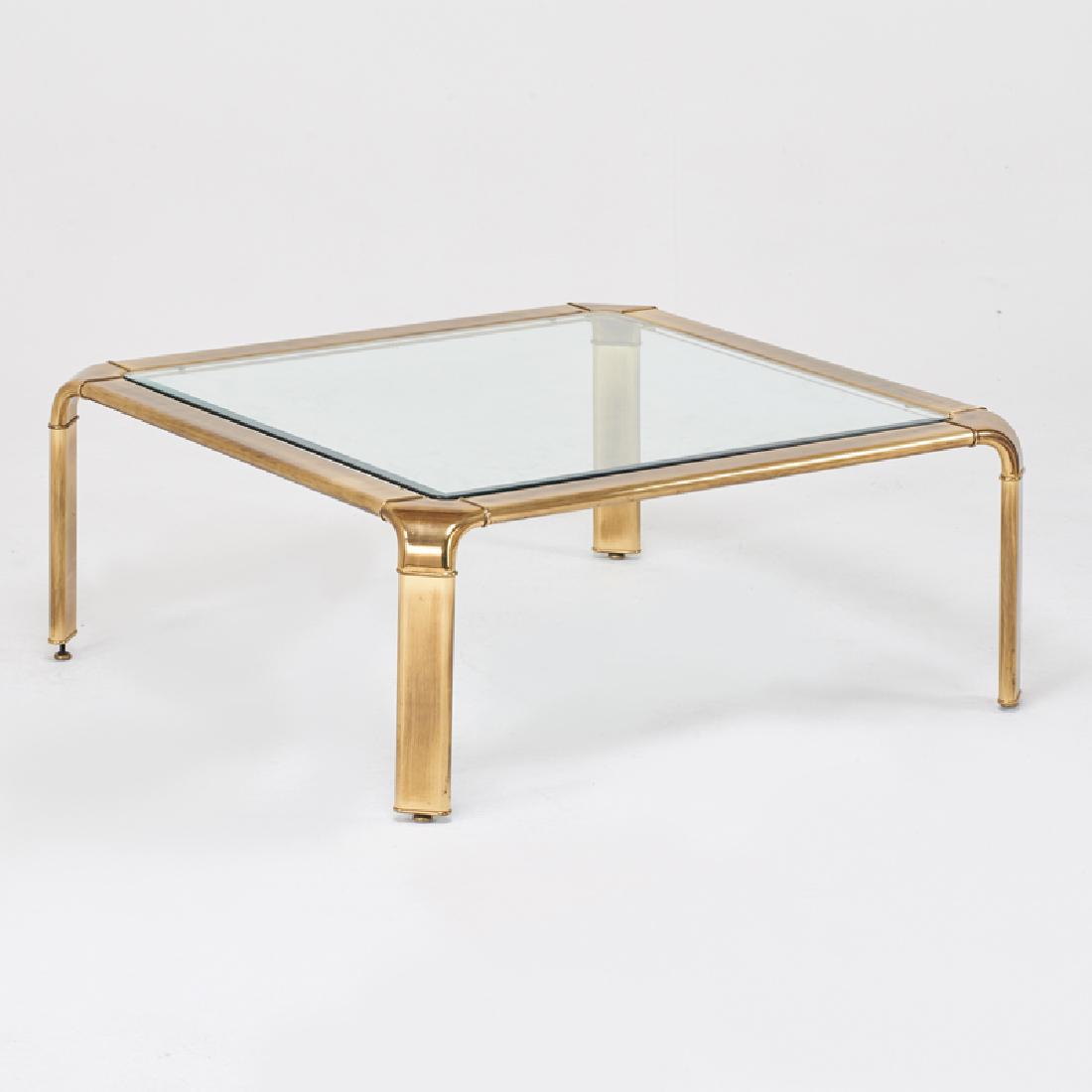 MASTERCRAFT: Cocktail table, USA, 1970s Brass-plated metal, beveled glass Unmarked 16 3/4" x 40" sq.