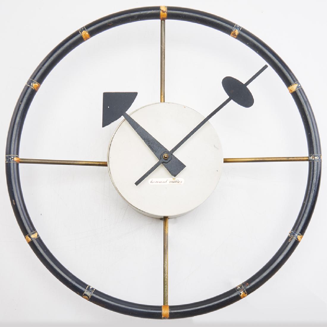 GEORGE NELSON; HOWARD MILLER: Steering wheel wall clock, USA, ca. 1960s Brass, enameled steel Metal tag to face, remnants of sticker label, impressed marks 3 1/4" x 12 1/2" dia.