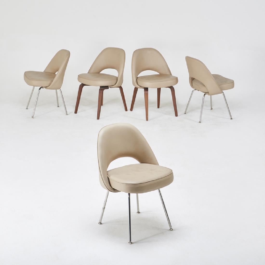STYLE OF EERO SAARINEN: Group of five Executive style side chairs (pair and set of three), 2000s Chromed steel, aniline leather, walnut Unmarked Pair: 32" x 22 1/2" x 21", three: 31" x 23" x 21"