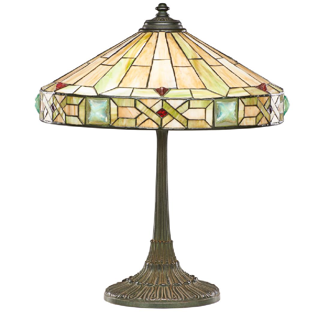 WILKINSON TABLE LAMP: Patinated metal, leaded slag glass, glass cabochons with "jeweled" shade, Brooklyn, NY, early 20th c. Stamped "5054" 22 1/2" x 18"