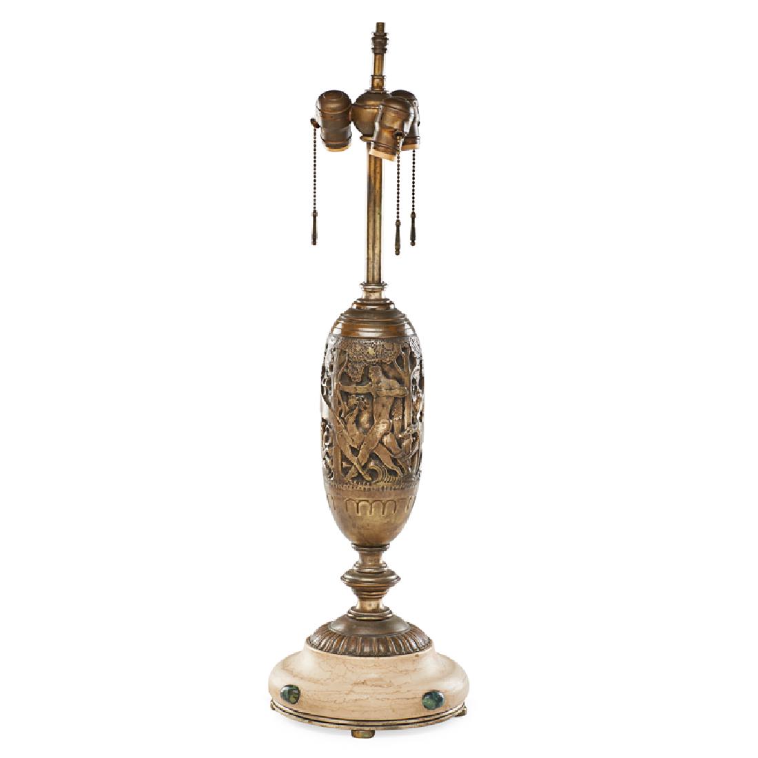 OSCAR BACH TABLE LAMP: Silvered bronze, travertine, and marble, decorated with continuous scene of hunters and hounds, USA, ca. 1926 Metal tag To base of finial: 29" Note: Design patent no.72,132, filed on November 3, 1926