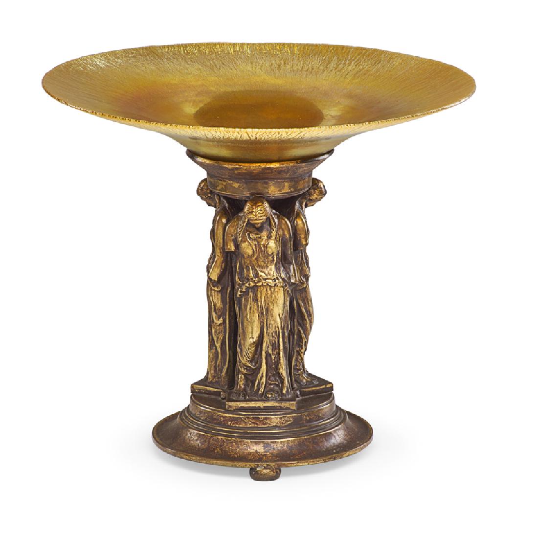 OSCAR BACH FOR SEGAR STUDIOS COMPOTE: Bronze patinated figural base fitted with iridescent glass insert (probably by Frederick Carder/Steuben Studios), USA, 1923-26 Stamped on bottom 13 1/4" x 15" dia