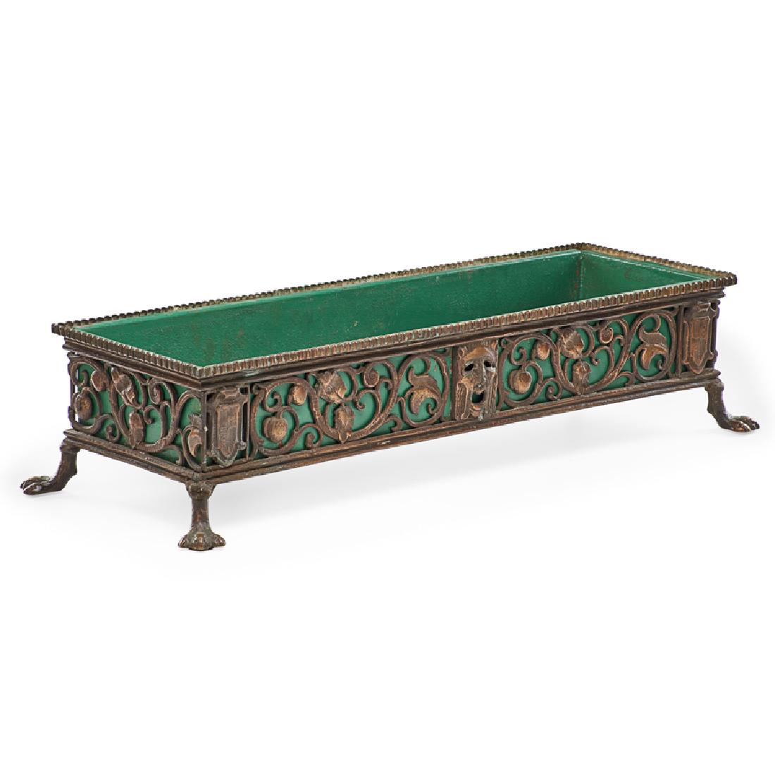 OSCAR BACH (Attr.) PLANTER: Patinated bronze, each panel with scrolling vines and dramatic masks with painted metal insert, USA, ca. 1923 Some panels numbered 075 7 1/4" x 30" x 10"