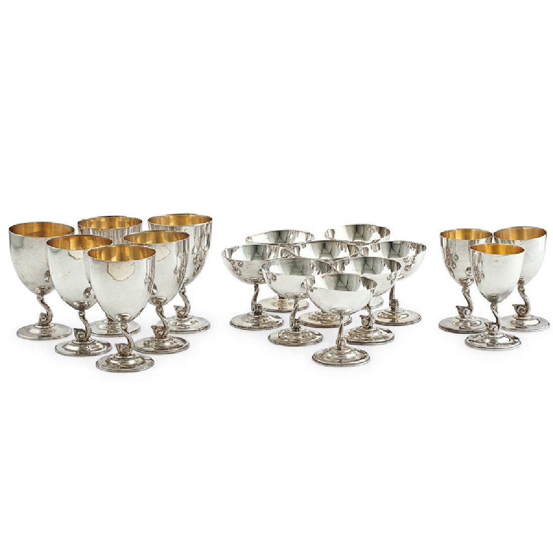 OSCAR BACH ASSEMBLED STERLING SILVER STEMWARE: Seventeen: Each with scrolling stem, Mexico, ca. 1920s Tallest: 5 1/2", 64 ozt