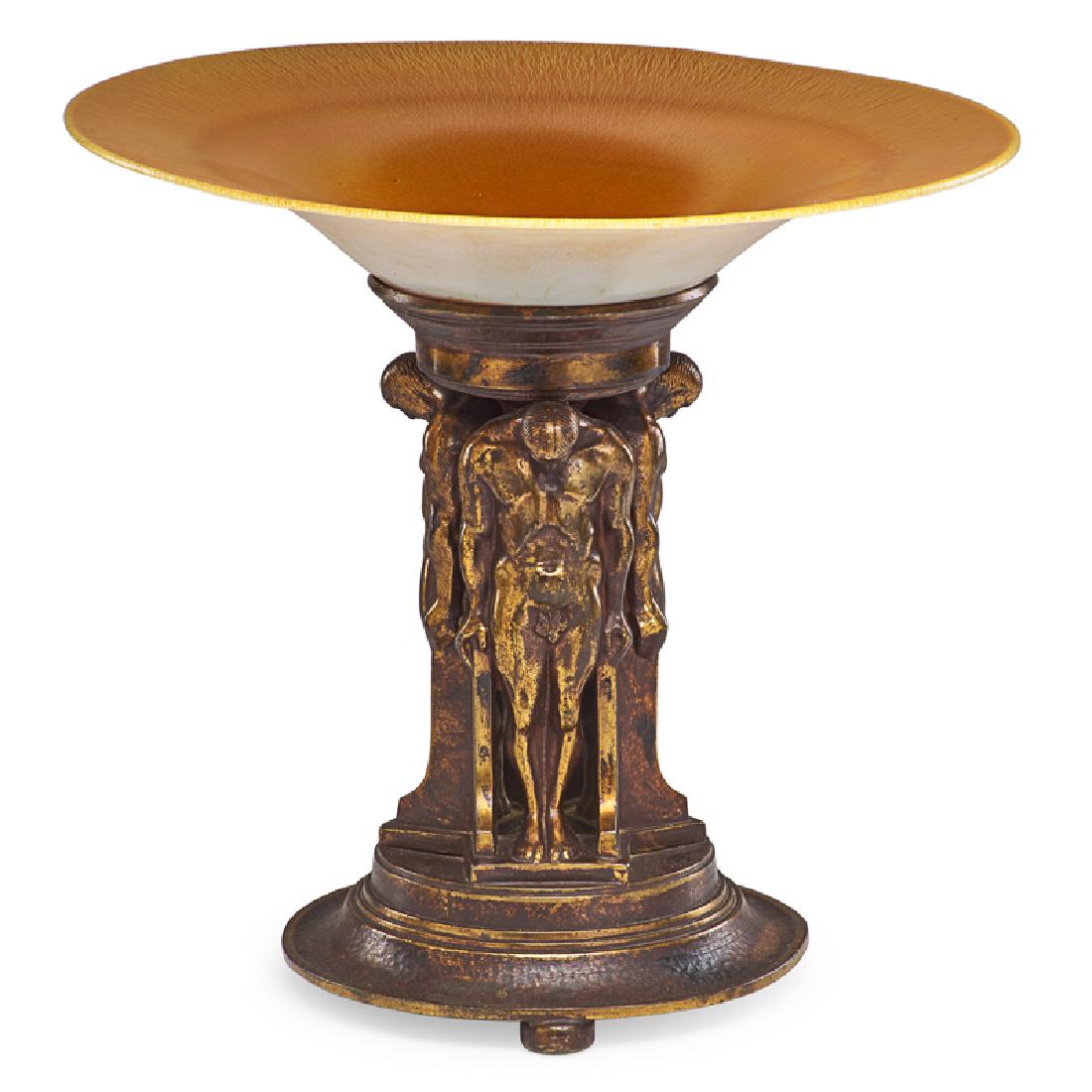 OSCAR BACH COMPOTE: Bronze patinated figural compote fitted with iridescent glass insert, USA, 1920s Signed on metal, marked on bottom "Lustre Art Studio" 13 1/4" x 14 1/4" dia