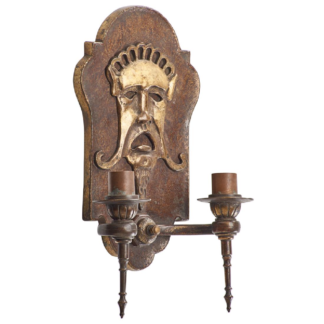 OSCAR BACH TWO-ARM SCONCE: Gilt and patinated bronze, cast with mask, USA, ca. 1924 Metal tag 13 3/4" x 8 1/4"