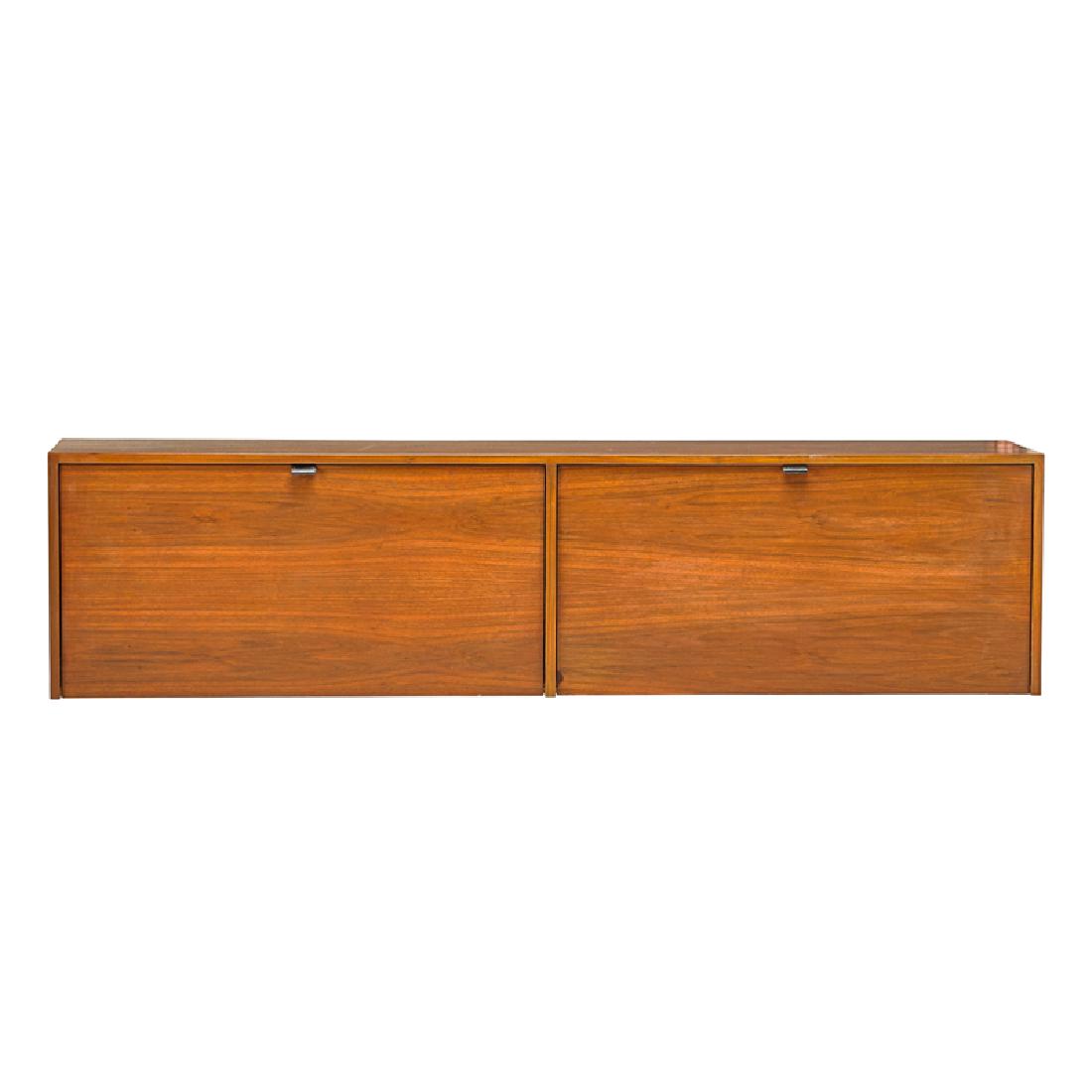 FLORENCE KNOLL ASSOCIATES WALL HANGING CABINET: Walnut, stitched leather, enameled wood, New York, 1960s Unmarked 18" x 72" x 15 1/4"