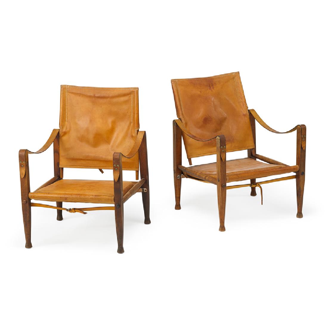 PAIR OF KAARE KLINT "SAFARI" CHAIRS: Stained oak, brass, leather, Denmark, 1960s Unmarked 32" x 22 1/2" x 3 1/2"