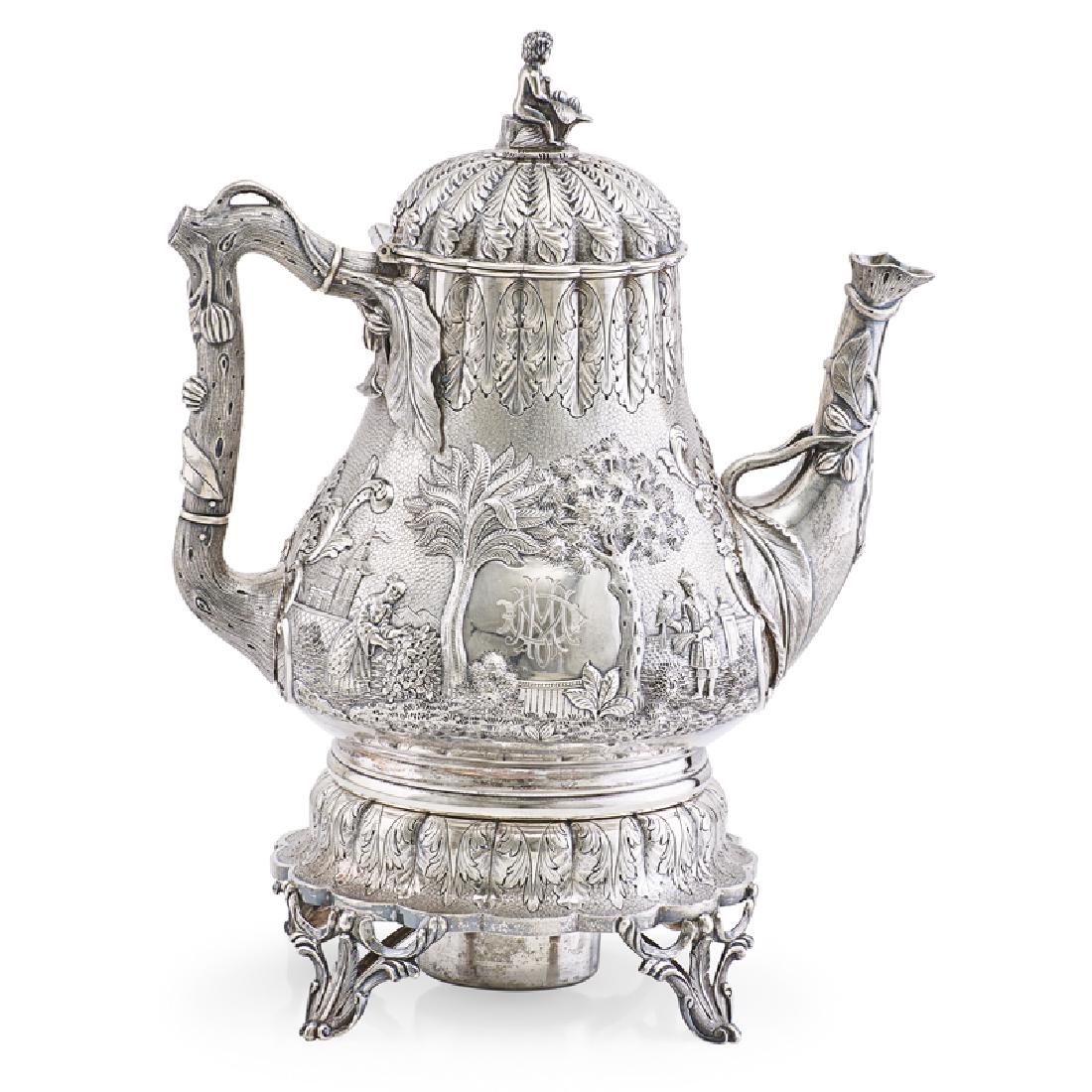 TIFFANY, YOUNG & ELLIS STERLING SILVER CHINOISERIE: KETTLE ON STAND Decorated with branch form handle and monogrammed reserves, USA, 1848-52 Marked 10", 41.2 ozt Literature: Charles Carpenter, Tiffany Silver, 1978, illus. p. 10, no. 4 Museum of Fine Ar