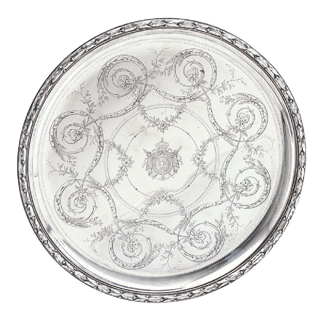 CHRISTOFLE SILVER PLATED SALVER: Engraved scroll and floral swag decoration with Napoleonic Empire insignia at center and leaf and berry border, France Marked "94518" 12" dia. Note: These trays, dating to 1859 or 1861, were ordered f