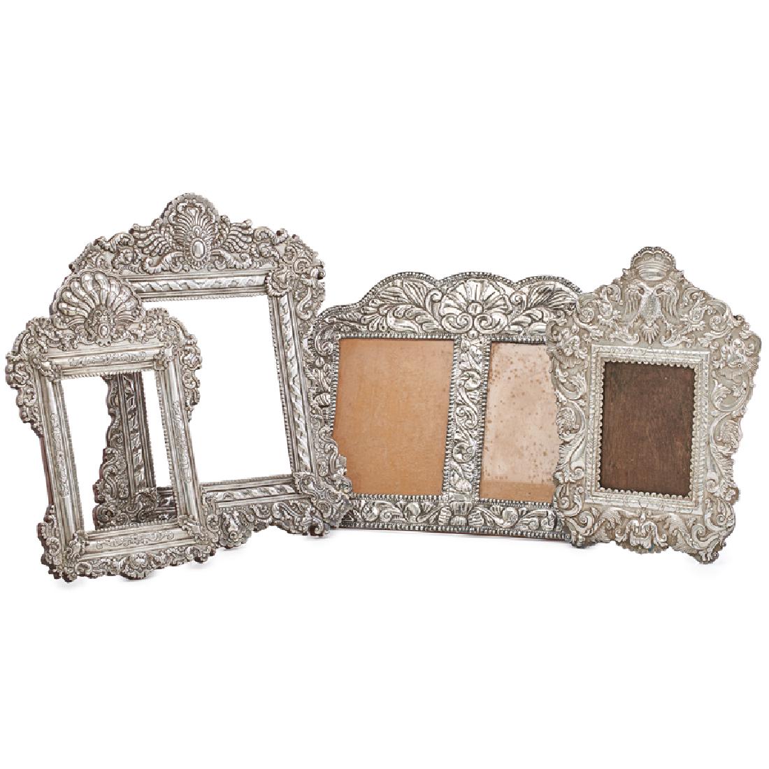 GROUP OF SILVER PICTURE FRAMES: Four: In Spanish Colonial or Russian Historical styles, 20th c. All marked Largest 19" x 15"